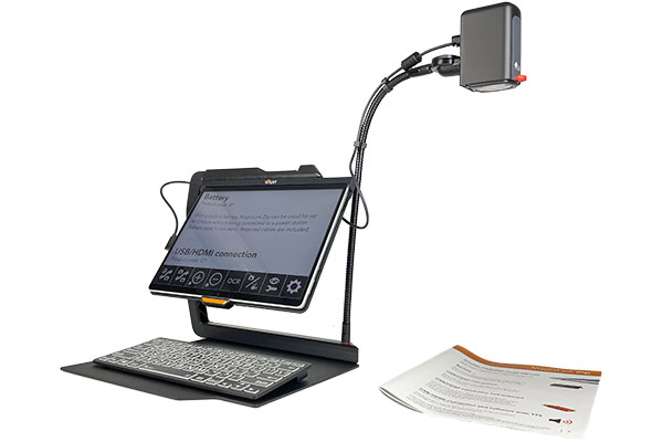 Image of the MagniLink TAB scanning a document to the right of the device. 