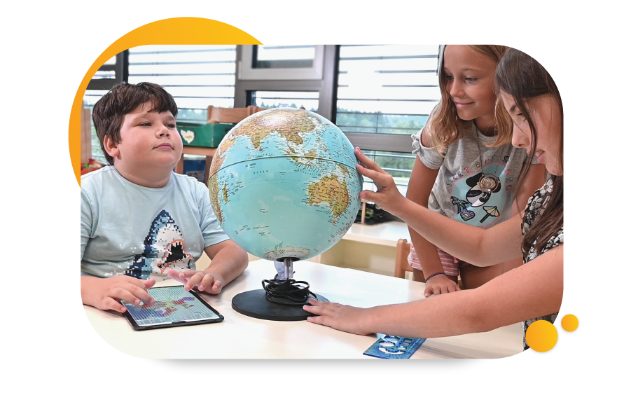 Image of student using the Feelif Pro in a classroom with two other students who are viewing a globe
