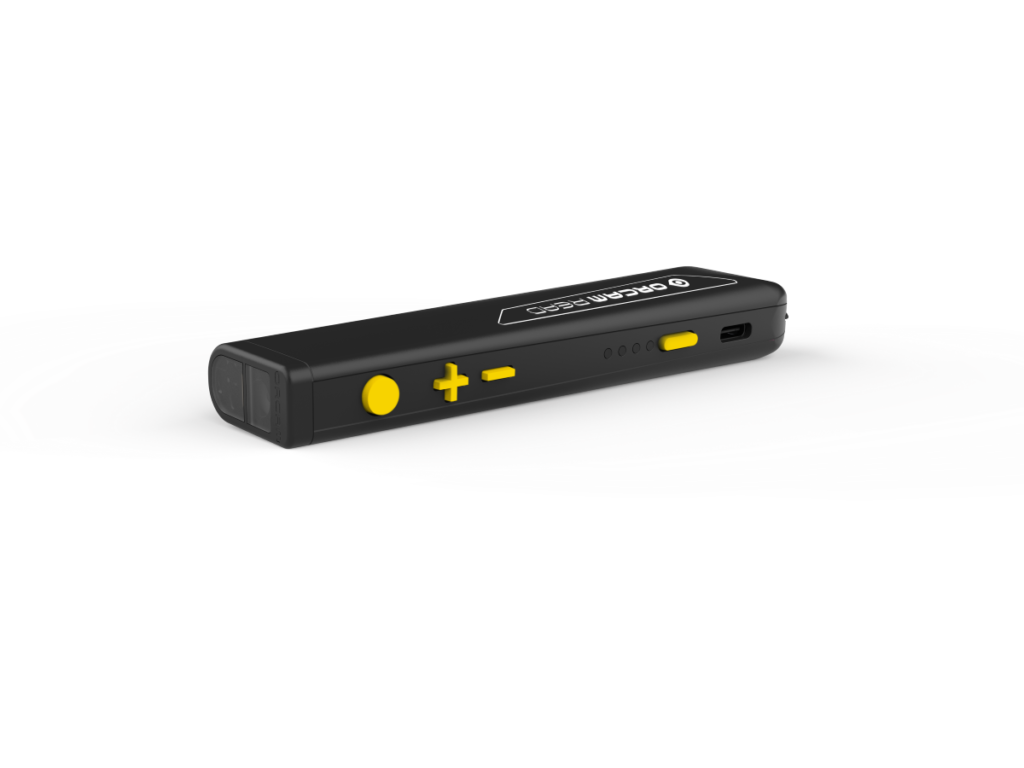 image of the orcam read 3 laying on its side so that you can see the yellow command buttons on the top of the device. From left to right - circle trigger button, volume up, volume down, power button