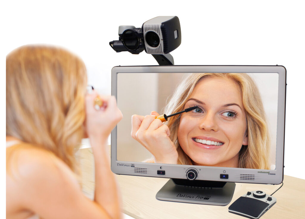 image of a woman using the davinci pro in self view mode to apply some makeup